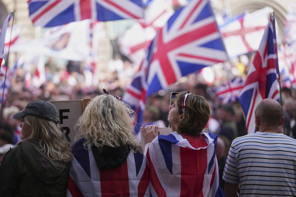 People demonstrate during the Tommy Robinson-led Unite the Kingdom march and rally, in London Saturday Sept. 13, 2025. (AP Photo/Joanna Chan)