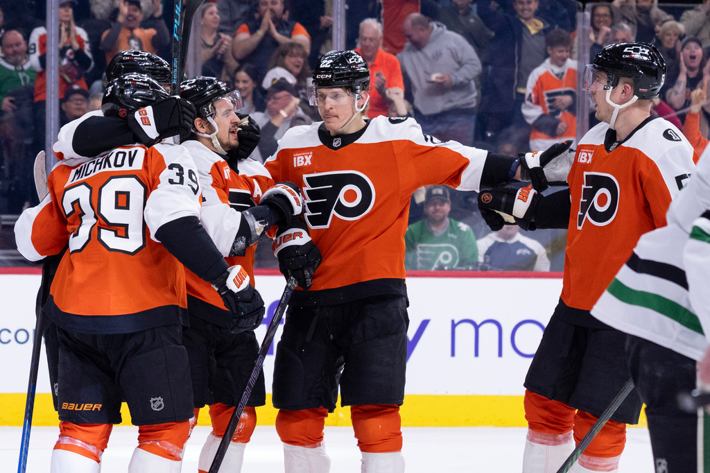 Philadelphia Flyers right winger Travis Konecny, center, celebrates his goal with tealmmates during the second period of an NHL hockey game against the Dallas Stars, Sunday, March 29, 2026, in Philadelphia. (AP Photo/Chris Szagola)