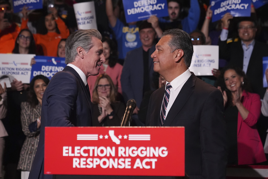 California Gov. Gavin Newsom, left, greets Sen. Alex Padilla, D-Calif., during a news conference Thursday, Aug. 14, 2025, in Los Angeles. (AP Photo/Marcio Jose Sanchez)