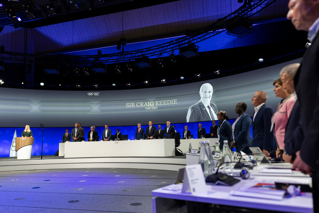 International Olympic Committee (IOC) President Kirsty Coventry, takes part in a minute silence, during the 146th Session of the International Olympic Committee (IOC) at the SwissTech Convention Centre, in Lausanne, Switzerland, Wednesday, June 24, 2026. (Cyril Zingaro/Keystone via AP)
