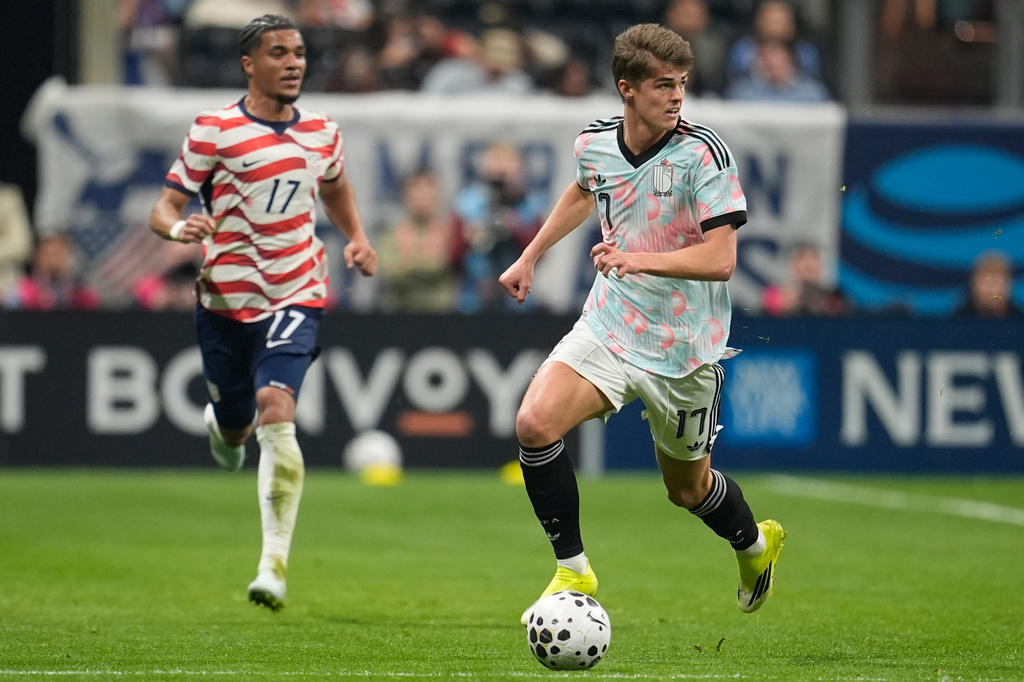 Belgium's Charles De Ketelaere (17) dribbles ahead of United States' Malik Tillman (17) during an international friendly soccer match, Saturday, March 28, 2026, in Atlanta. (AP Photo/Mike Stewart)