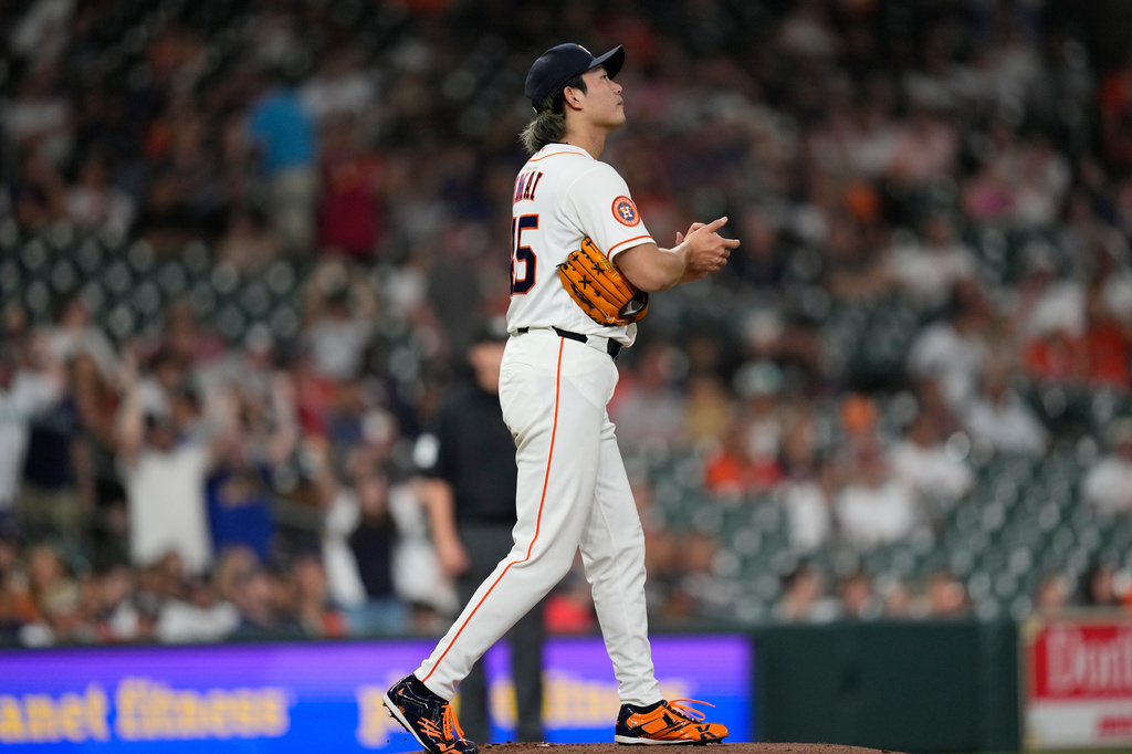 Houston Astros starting pitcher Tatsuya Imai looks to the scoreboard after giving up a grand slam to Seattle Mariners' Dominic Canzone during the fourth inning of a baseball game Tuesday, May 12, 2026, in Houston. (AP Photo/David J. Phillip)