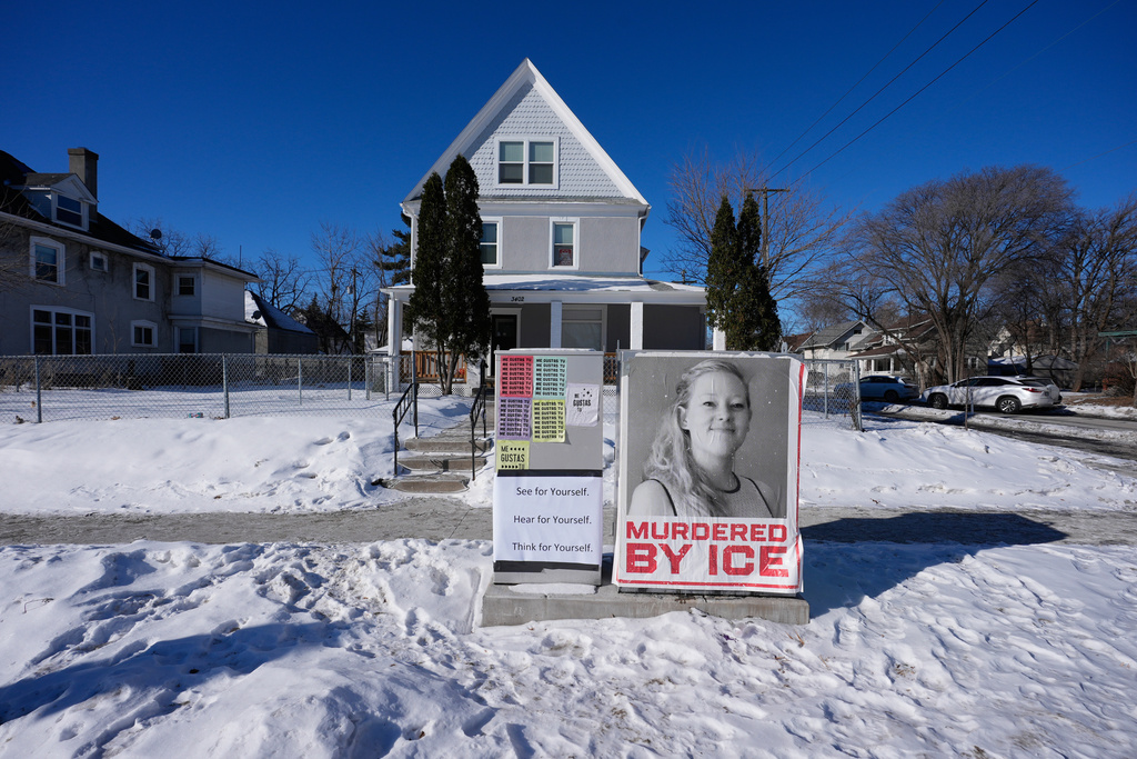 A photo of Renee Good is displayed in front of a home on Saturday, Jan. 31, 2026, in Minneapolis. (AP Photo/Alex Brandon)