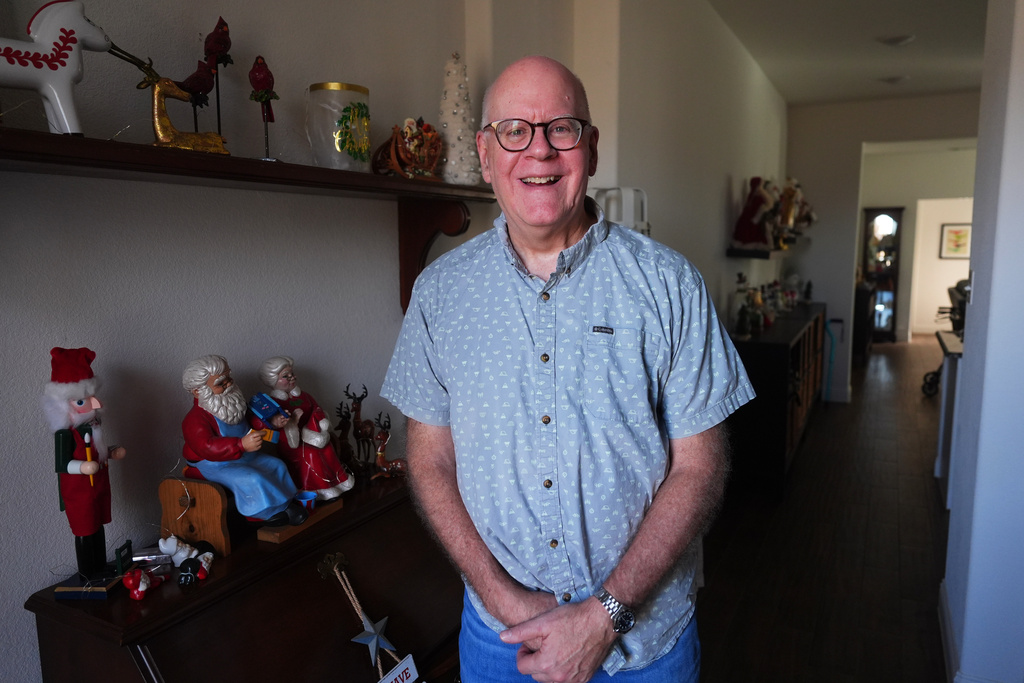Chuck Dietrick poses for a portrait at his home in Anna, Texas, Thursday, Dec. 18, 2025. (AP Photo/LM Otero)