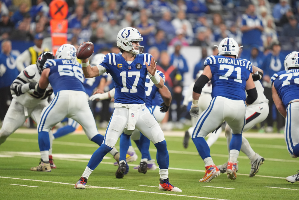 Indianapolis Colts quarterback Daniel Jones (17) throws a pass against the Houston Texans during the first half of an NFL football game Sunday, Nov. 30, 2025, in Indianapolis. (AP Photo/Michael Conroy)