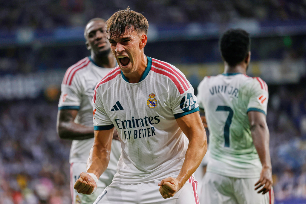 Real Madrid's Carlos Espi celebrates after scoring his side's second goal during a Spanish La Liga soccer match between Espanyol and Real Madrid in Barcelona, Spain, Saturday, Aug. 22, 2026. (AP Photo/Joan Monfort)