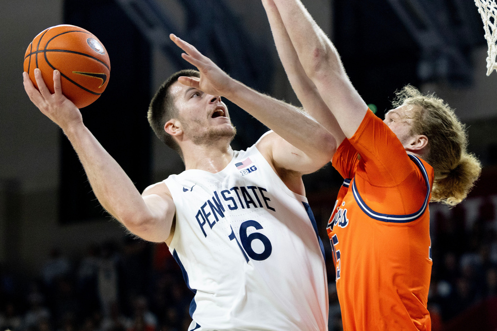 Penn State forward Tibor Mirtic (16) takes a shot over Illinois forward Jake Davis during the first half of an NCAA college basketball game, Saturday, Jan. 3, 2026, in Philadelphia. (AP Photo/Laurence Kesterson)