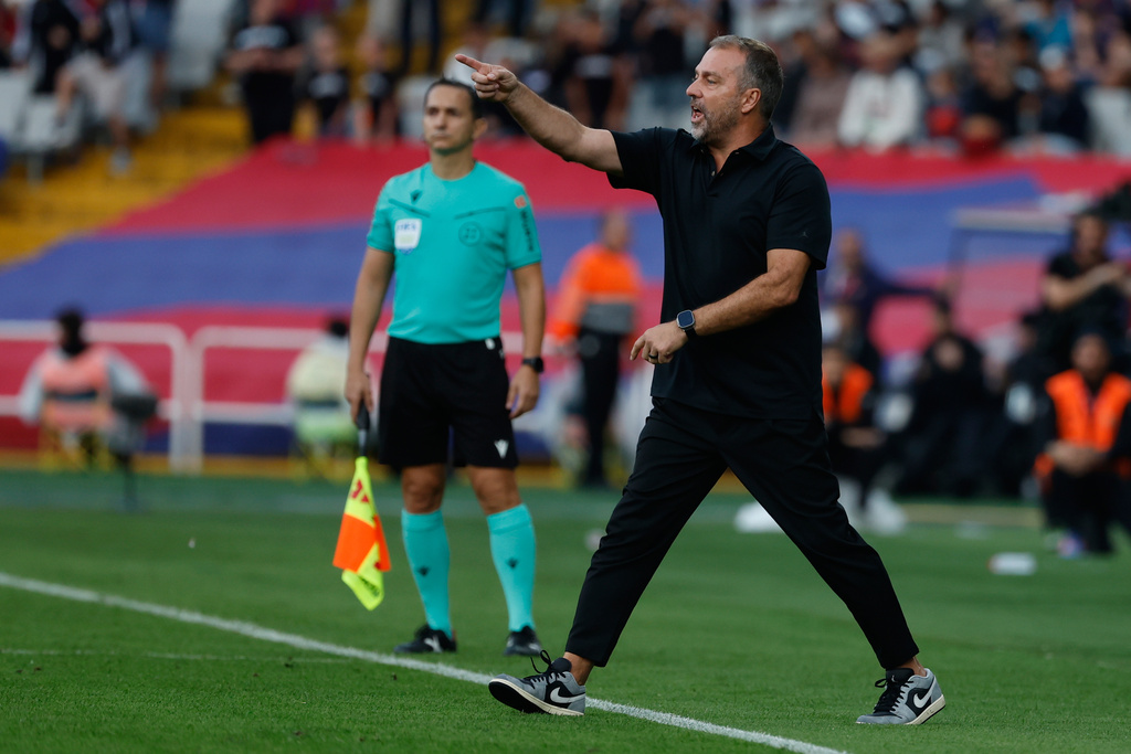 Barcelona's head coach Hansi Flick reacts during a La Liga soccer match between Barcelona and Girona in Barcelona, Spain, Saturday, Oct. 18, 2025. AP Photo/Joan Monfort)