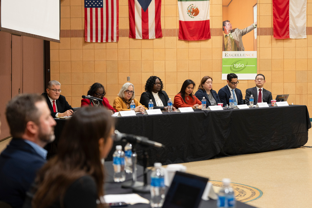 The Illinois Accountability Commission listens to a witness' account during the first hearing at Arturo Velasquez Institute at Richard J. Daley College in the Lower West Side of Chicago, Thursday, Dec. 18, 2025. (Chicago Sun-Times via AP)
