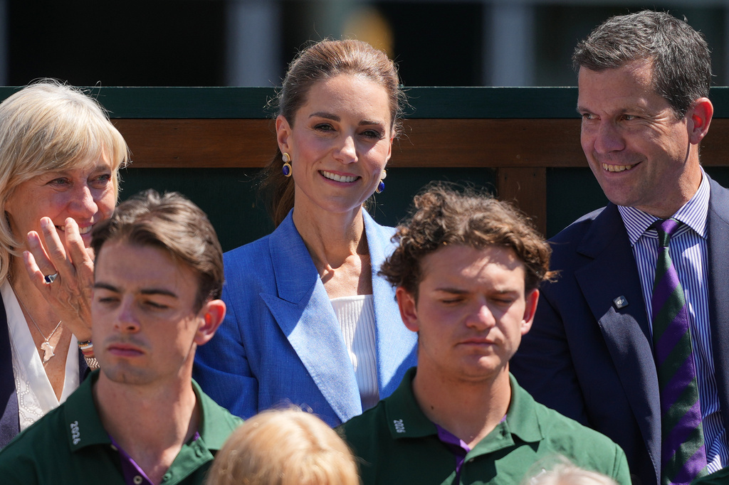 Britain's Kate, the Princess of Wales, center, All England Club chair Deborah Jevans, left, and former tennis player Tim Henman, watch the second round men's singles match between Otto Virtanen of Finland and Arthur Fery of Britain at the Wimbledon Tennis Championships in London, Thursday, July 2, 2026.(AP Photo/Kin Cheung)