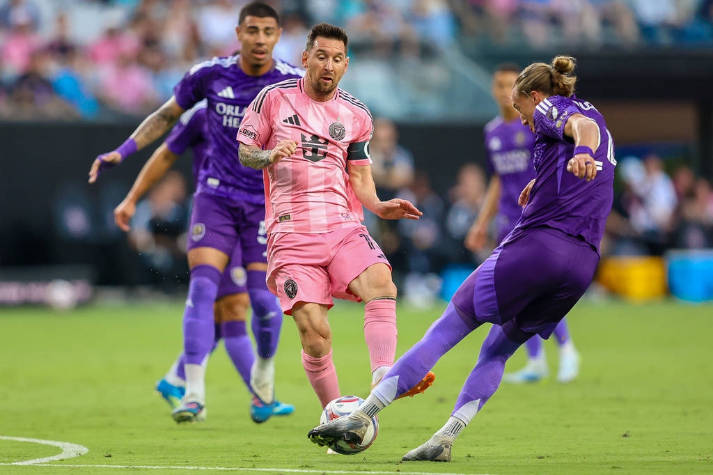 Inter Miami forward Lionel Messi (10) battles for the ball in the first half during an MLS soccer match against the Orlando City, Saturday, May 2, 2026, in Miami. (AP Photo/Chris Arjoon)