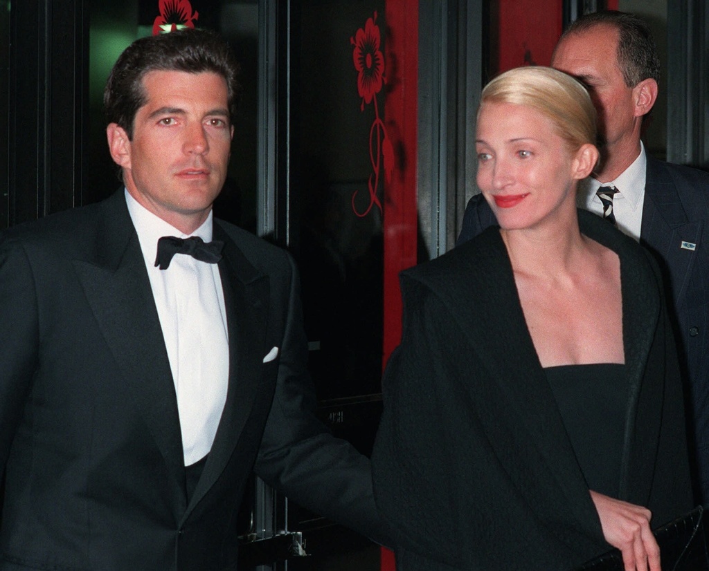 FILE - John F. Kennedy, Jr., left, and his wife, Carolyn Bessette Kennedy, arrive at the Minskoff Theatre in New York on April 6, 1998. (AP Photo/Mitch Jacobson, File)