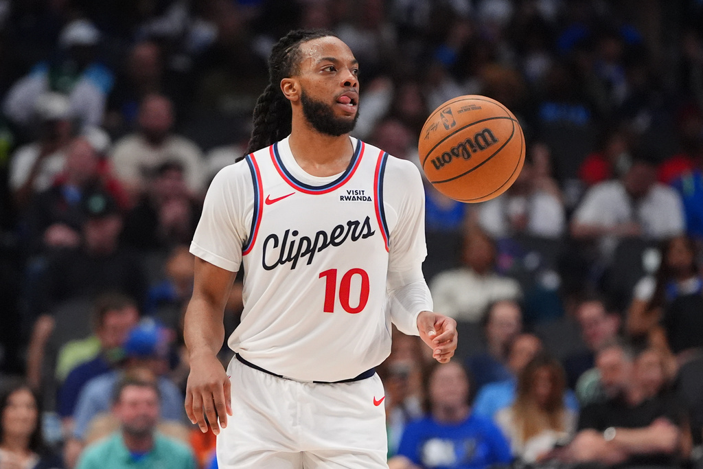 Los Angeles Clippers guard Darius Garland moves the ball during the second half of an NBA basketball game against the Dallas Mavericks in Dallas, Saturday, March 21, 2026. (AP Photo/LM Otero)