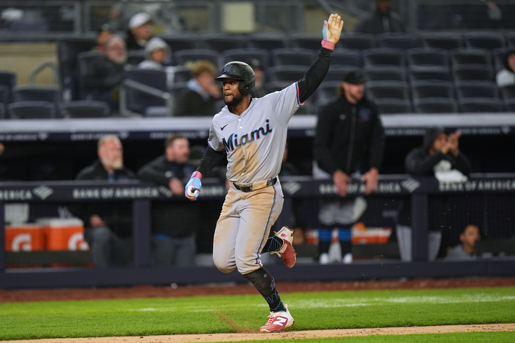 Miami Marlins' Otto Lopez reacts as he scores on a double hit by Graham Pauley during the eighth inning of a baseball game against the New York Yankees, Sunday, April 5, 2026, in New York. (AP Photo/Seth Wenig)