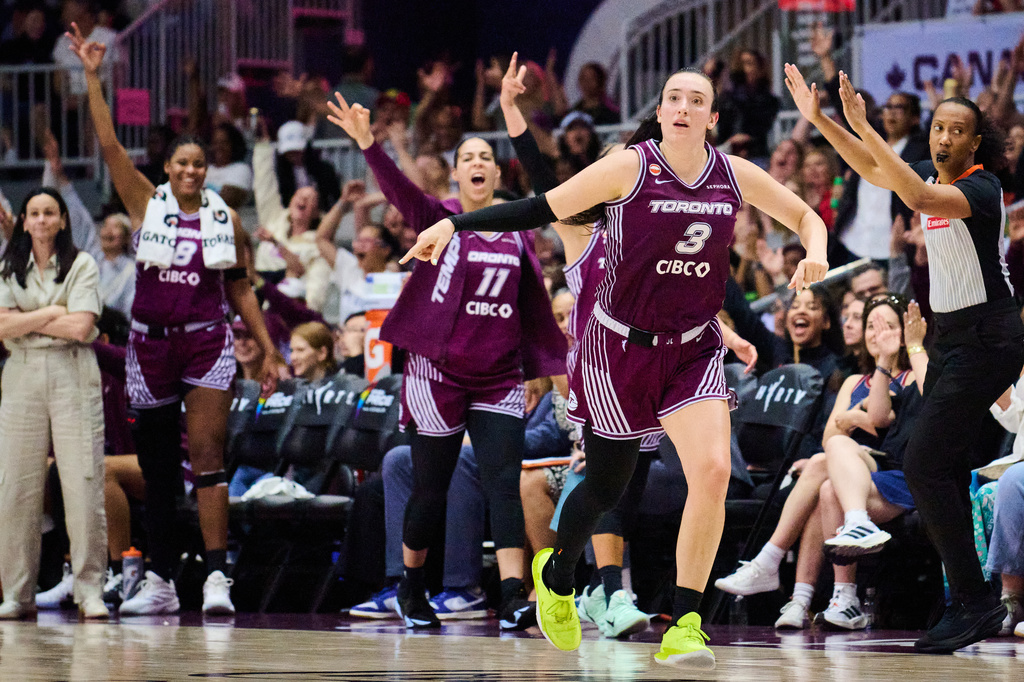 Toronto Tempo's Marina Mabrey (3) celebrates with her team during the second half of a WNBA basketball game against the Los Angeles Sparks in Toronto, hursday, June 25, 2026. (Sammy Kogan/The Canadian Press via AP)
