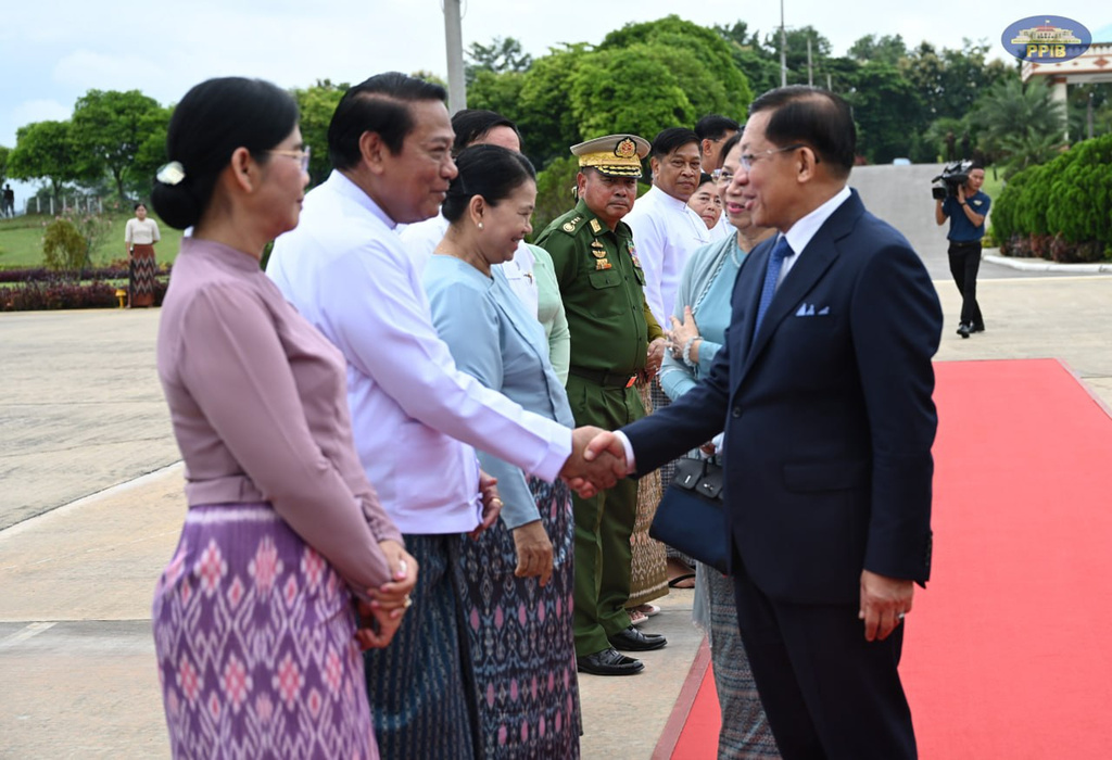 In this photo released by Myanmar President Office, Myanmar President Min Aung Hlaing, right, shakes hands with Lower House Speaker Khin Yi, second left, upon his departure to Vietnam, at the Naypyitaw international airport Friday, Sept. 4, 2026, in Naypyitaw, Myanmar. (Myanmar President Office via AP)