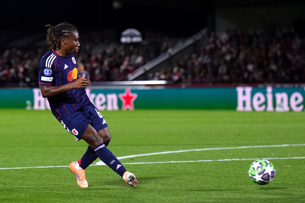 OL Lyonnes' Melchie Dumornay scores their side's first goal during the Women's Champions League soccer match between Arsenal and OL Lyonnes at Meadow Park, Borehamwood, England, Tuesday, Oct, 7, 2025. (John Walton/PA via AP)