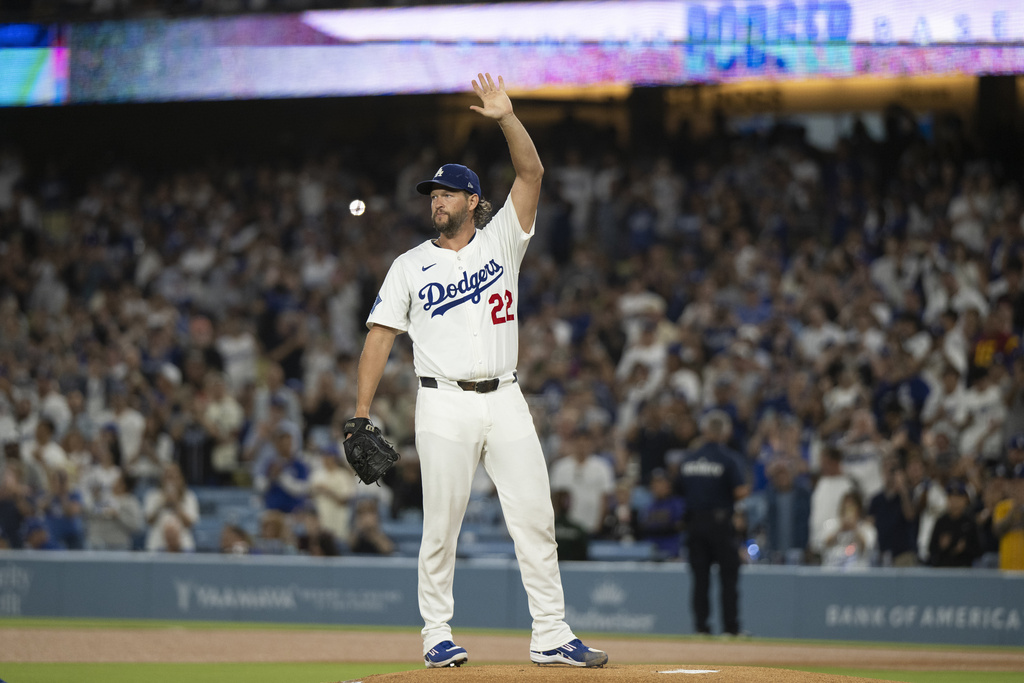 Los Angeles Dodgers starting pitcher Clayton Kershaw waves toward the stands before a baseball game against the San Francisco Giants in Los Angeles, Friday, Sept. 19, 2025. (AP Photo/Kyusung Gong)