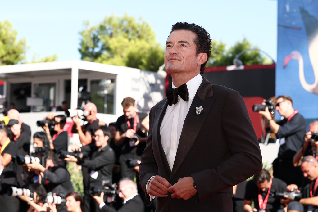 Orlando Bloom poses for photographers at the red carpet for the film 'Bucking Fastard' during the 83rd edition of the Venice Film Festival in Venice, Italy, on Thursday, Sept. 3, 2026. (Photo by Millie Turner/Invision/AP)