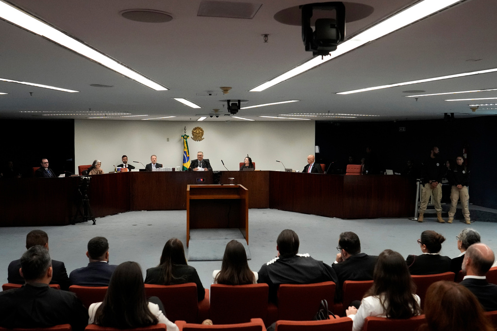 Judge Flavio Dino, center top, presides over the first day of trial of those accused of ordering the murder of councilwoman Marielle Franco at the Supreme Court in Brasilia, Brazil, Tuesday, Feb. 24, 2026. (AP Photo/Eraldo Peres)