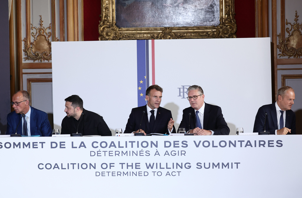 From left: German Chancellor Friedrich Merz, Ukrainian President Volodymyr Zelensky, French President Emmanuel Macron, British Prime Minister Keir Starmer and Polish Prime Minister Donald Tusk attend the Coalition of the Willing summit on security guarantees for Ukraine, at the Hotel des Invalides in Paris, Monday, July 2026. (Teresa Suares/Pool Photo via AP)