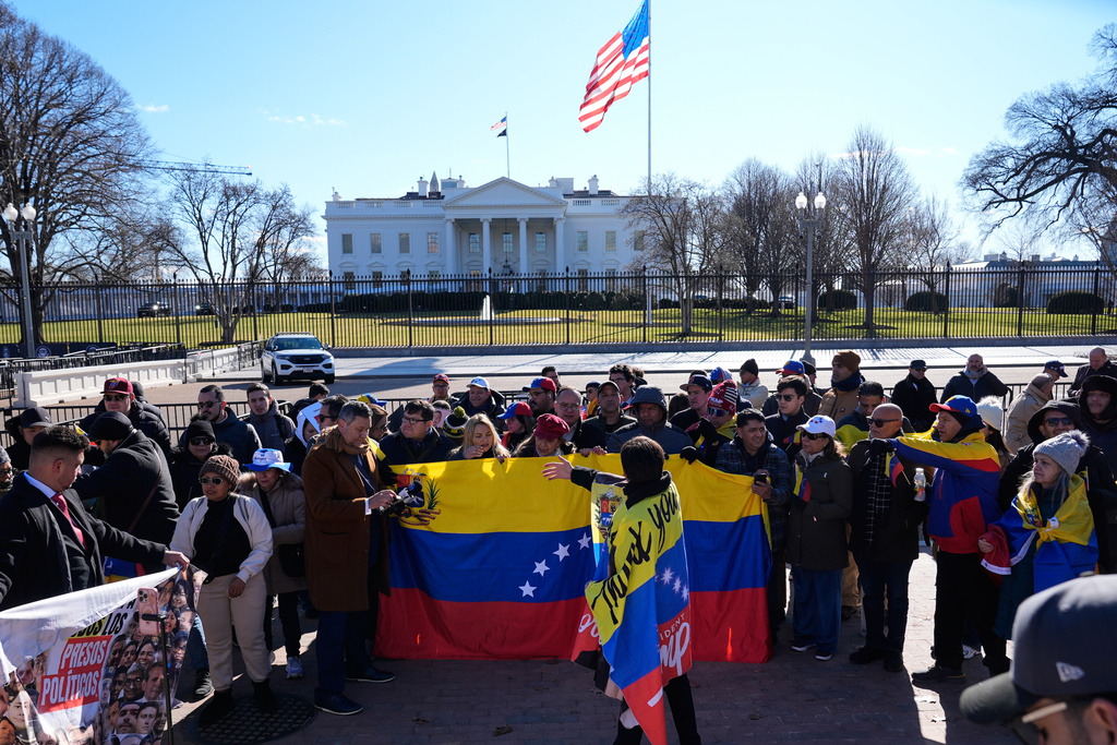 People rally as Venezuelan opposition leader María Corina Machado meets with President Donald Trump at the White House Thursday, Jan. 15, 2026, in Washington. (AP Photo/Pablo Martinez Monsivais)