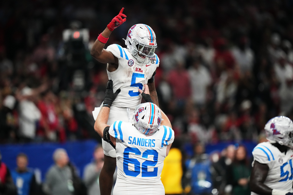 Mississippi running back Kewan Lacy (5) celebrates his touchdown in the second half of the Sugar Bowl NCAA college football playoff quarterfinal game against Georgia in New Orleans, Thursday, Jan. 1, 2026. (AP Photo/Mathew Hinton)