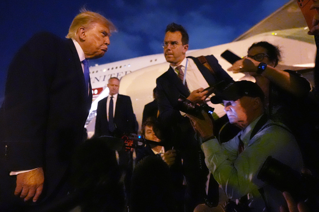 President Donald Trump talks to reporters before he boards Air Force One, Tuesday, Aug. 4, 2026, at Los Angeles International Airport in Los Angeles. (AP Photo/Mark Schiefelbein)