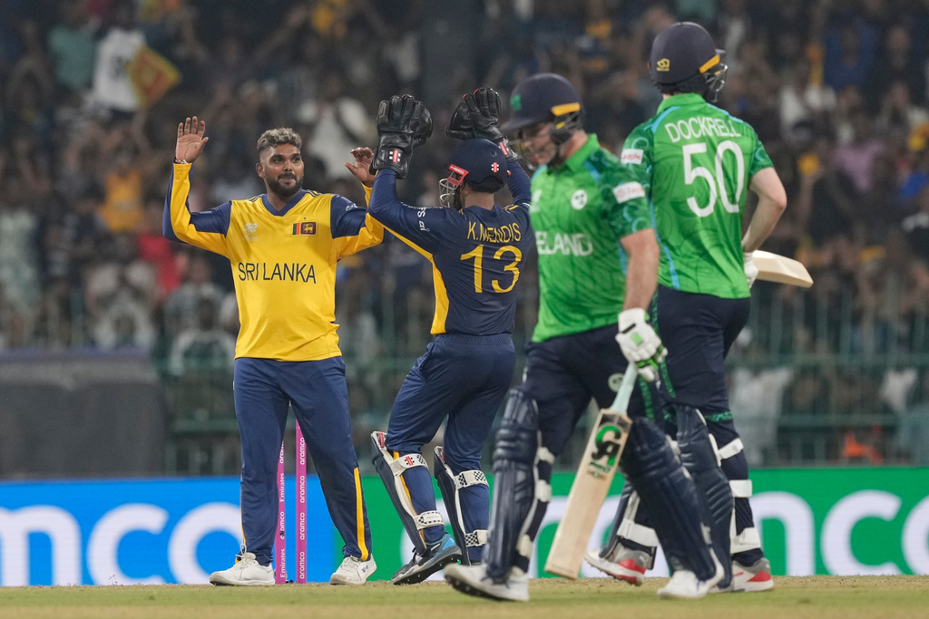 Sri Lanka's Wanindu Hasaranga, left, celebrates the wicket of Ireland's Curtis Campher during the T20 World Cup cricket match between Sri Lanka and Ireland in Colombo, Sri Lanka, Sunday, Feb. 8, 2026. (AP Photo/Eranga Jayawardena)