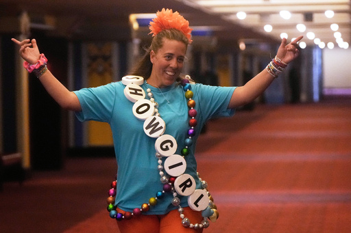 Aimee Jay gestures walks towards her daughters before the official release of Taylor Swift's new album, "The Life of a Showgirl," at the AMC Metreon in San Francisco, Friday, Oct. 3, 2025. (AP Photo/Jeff Chiu) Aimee Jay gestures walks towards her daughters before the official release of Taylor Swift's new album, "The Life of a Showgirl," at the AMC Metreon in San Francisco, Friday, Oct. 3, 2025. (AP Photo/Jeff Chiu)