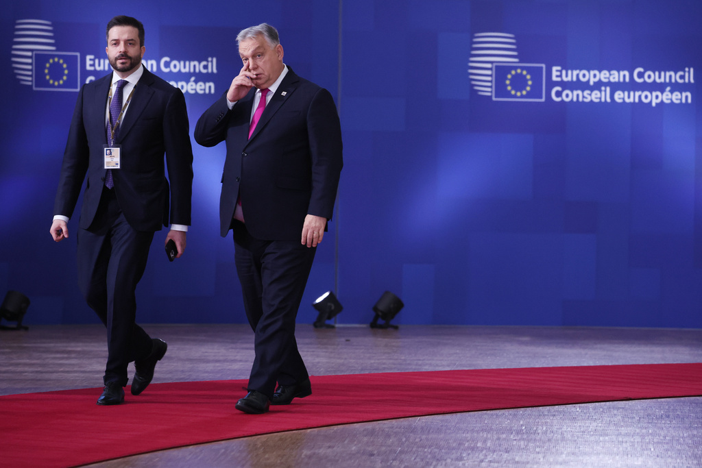 Hungary's Prime Minister Viktor Orban, right, arrives for the EU Summit in Brussels, Thursday, Dec. 18, 2025. (AP Photo/Omar Havana)