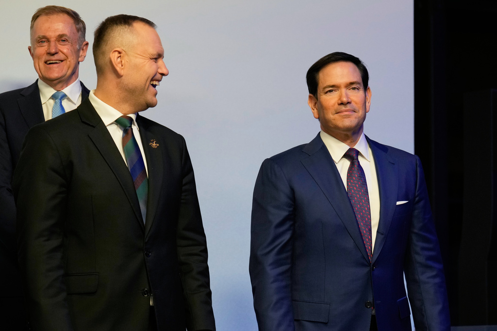U.S. Secretary of State Marco Rubio, right, looks on ahead of a group photo at the Heads of states dinner, at the 2026 Winter Olympics, in Milan, Italy, Thursday, Feb. 5, 2026. (AP Photo/Luca Bruno, Pool)