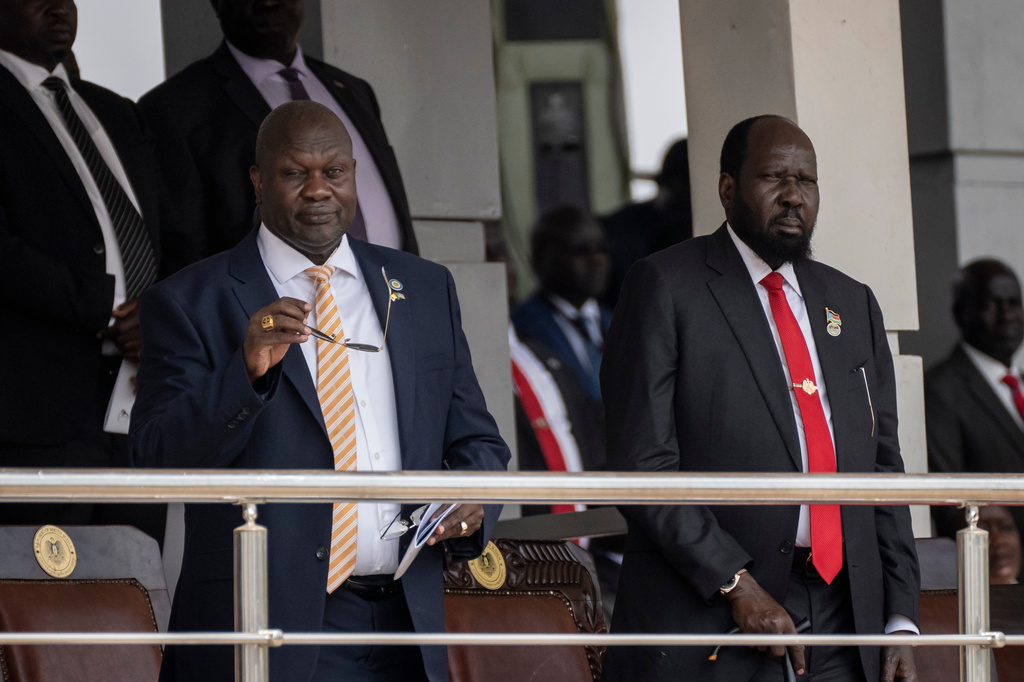 FILE - South Sudan's President Salva Kiir, right, and Vice President Riek Machar, left, attend a Holy Mass led by Pope Francis at the John Garang Mausoleum in Juba, South Sudan Sunday, Feb. 5, 2023. (AP Photo/Ben Curtis, File)