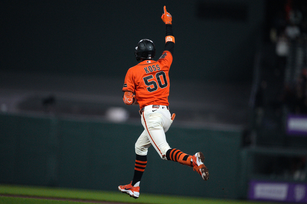 San Francisco Giants' Christian Koss gestures as he rounds the bases after hitting a two-run home run against the Arizona Diamondbacks during the fourth inning of a baseball game in San Francisco, Friday, Aug. 28, 2026. (AP Photo/Tony Avelar)