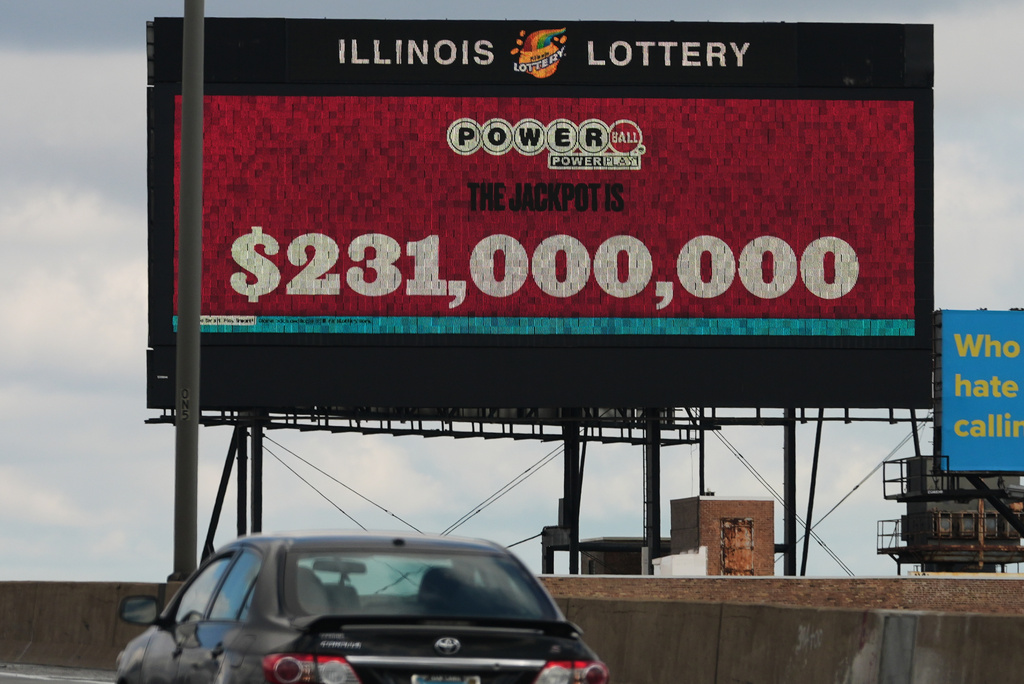 A digital billboard along Interstates 90/94 displays the estimated Powerball jackpot, Monday, April 6, 2026, in Chicago. (AP Photo/Nam Y. Huh)