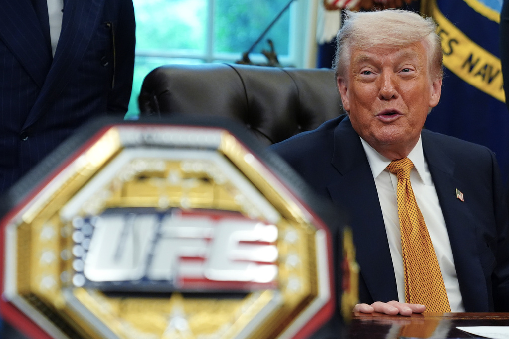 President Donald Trump meets with UFC fighters, Wednesday, May 6, 2026, in the Oval Office of the White House, in Washington. (AP Photo/Jacquelyn Martin)