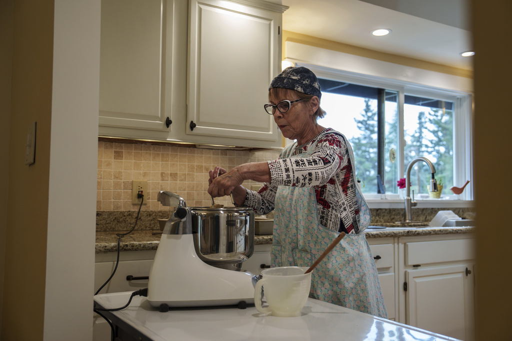 Cheryl Ewaldsen bakes bread for Community Loaves at her home in Edmonds, Wash., Saturday, Sept. 6, 2025. (AP Photo/Annika Hammerschlag)