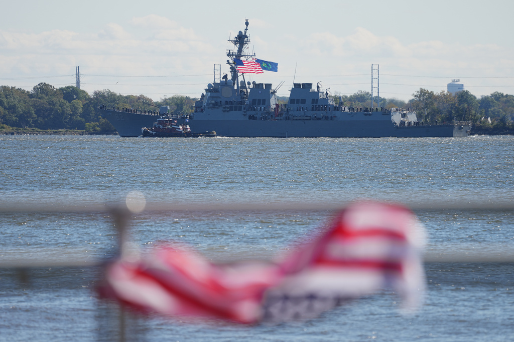 The USS Lassen passes the viewing stand during the 250th anniversary of the founding of the U.S. Navy and Marine Corps, along the Delaware River, Thursday, Oct. 9, 2025, in Philadelphia. (AP Photo/Matt Rourke)