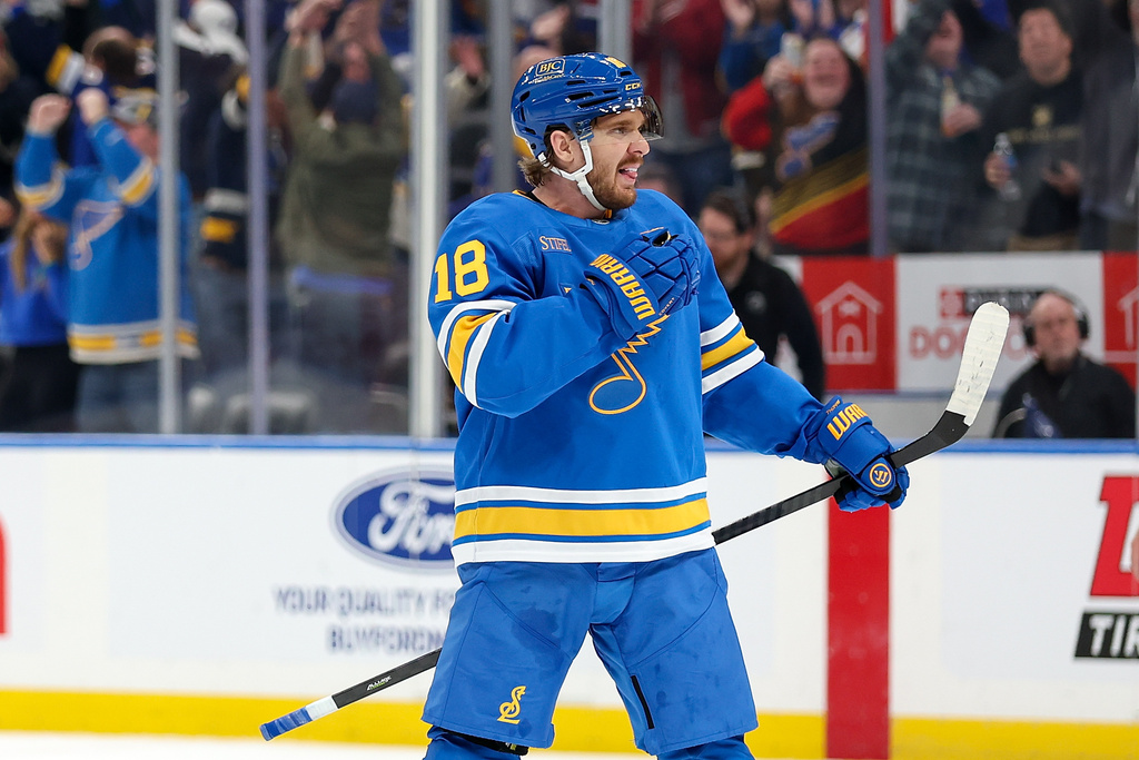 St. Louis Blues' Robert Thomas (18) reacts after scoring during the overtime period of an NHL hockey game against the Edmonton Oilers Friday, March 13, 2026, in St. Louis. (AP Photo/Scott Kane)