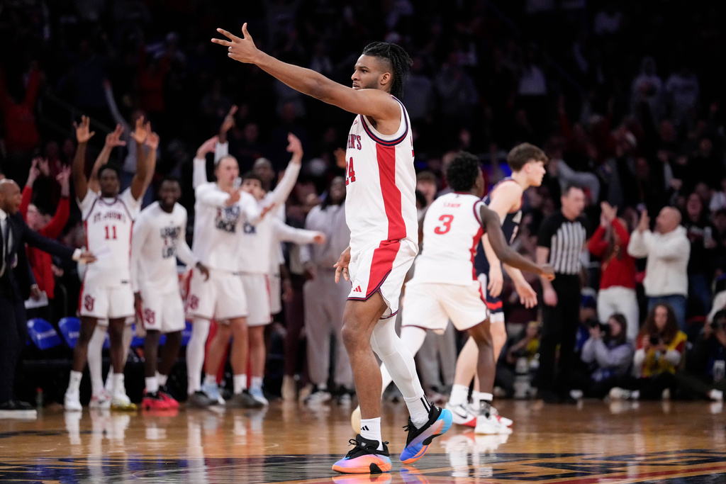St. John's forward Zuby Ejiofor (24) gestures after scoring a three point goal during the second half of an NCAA college basketball game against UConn in the championship of the Big East tournament, Saturday, March 14, 2026, in New York. (AP Photo/Yuki Iwamura)