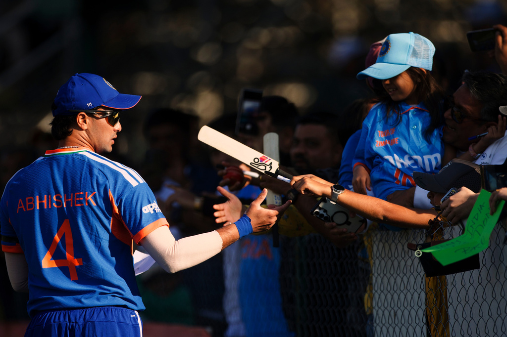 India's Abhishek Sharma signs autographs during the second T20 cricket match between Zimbabwe and India in Harare, Zimbabwe, Saturday, July 25, 2026. (AP Photo/Wonder Mashura)