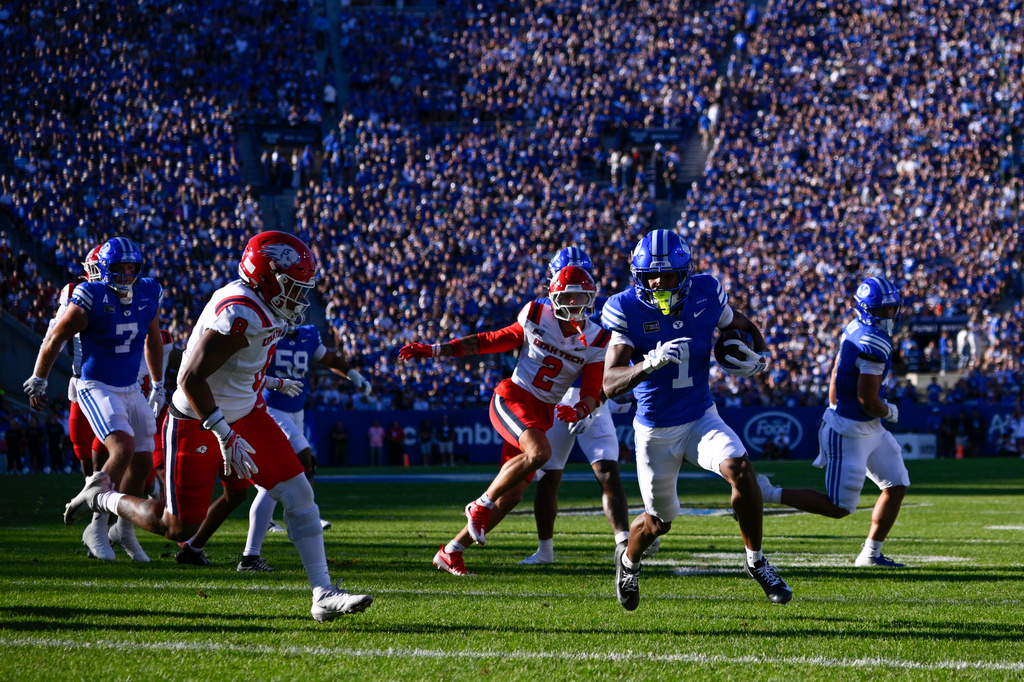 BYU wide receiver Legend Glasker (1) runs to a touchdown in the first half during an NCAA college football game against Utah Tech Saturday, Sept. 5, 2026 in Provo, Utah. (AP Photo/Alex Goodlett)