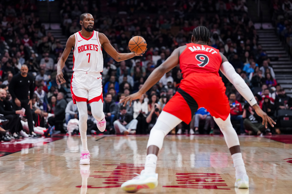 Houston Rockets forward Kevin Durant (7) dribbles up the court during the first half of preseason NBA basketball action in Toronto, Wednesday, Oct. 29, 2025. (Thomas Skrlj/The Canadian Press via AP)