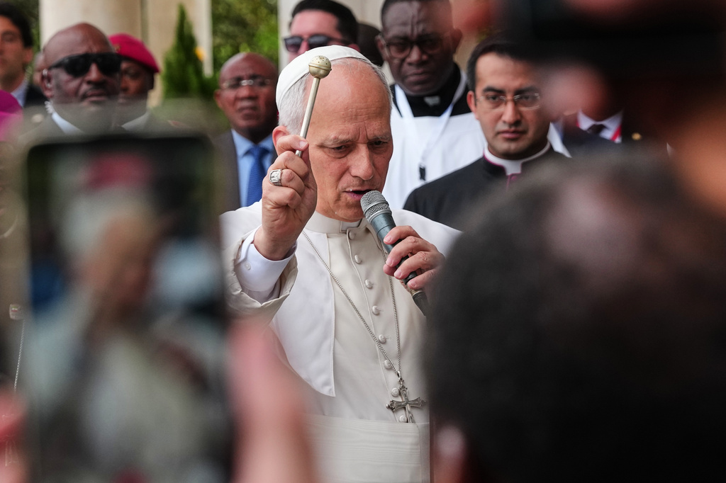 Pope Leo XIV blesses the faithful at the Basilica of the Immaculate Conception in Mongomo, Equatorial Guinea, Wednesday, April 22, 2026. (AP Photo/Misper Apawu)