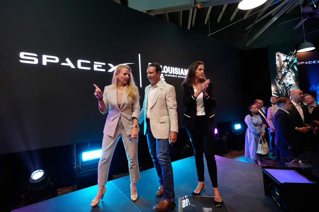 SpaceX President and COO Gwynne Shotwell, left, speaks with Louisiana Gov. Jeff Landry, center, and Sec. of Louisiana Economic Development Susan Bonnett Bourgeois during an event with SpaceX announcing a deal to build a new spaceport in Louisiana, Tuesday, Aug. 25, 2026, in Abbeville, La. (AP Photo/Gerald Herbert)