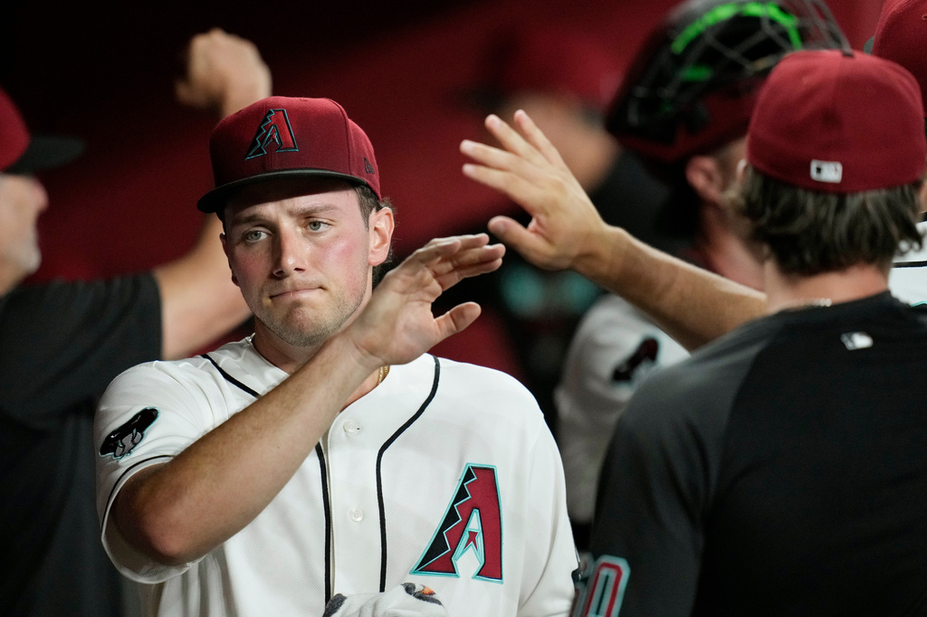 Arizona Diamondbacks starting pitcher Brandon Pfaadt gets high-fives as he walks through the team dugout prior to a baseball game against the St. Louis Cardinals, Saturday, July 18, 2026, in Phoenix. (AP Photo/Ross D. Franklin)