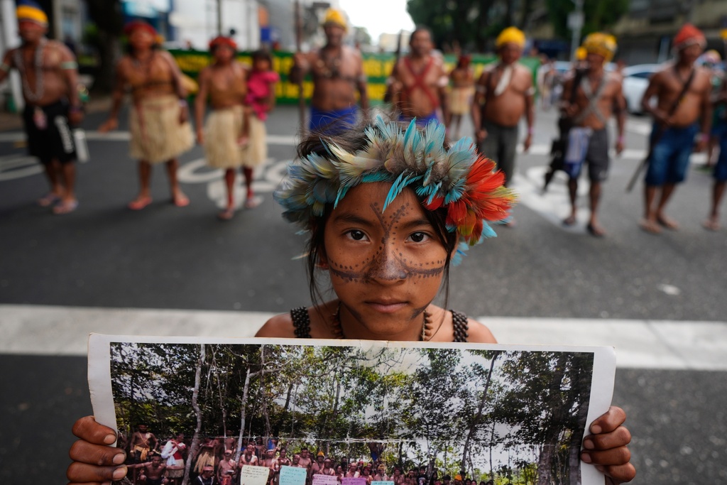 An Indigenous activist demonstrates for protecting the Amazon at a climate protest during the COP30 U.N. Climate Summit, Saturday, Nov. 15, 2025, in Belem, Brazil. (AP Photo/Fernando Llano)