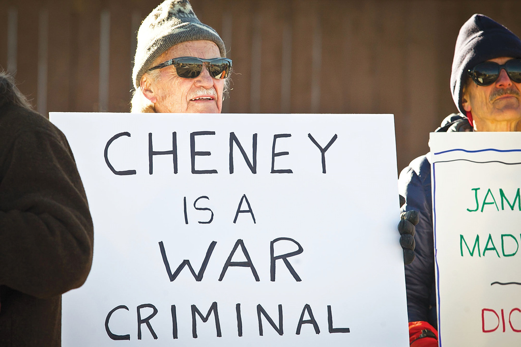 FILE - Norman Illsley and other protestors line up outside the Marian H. Rochelle Gateway Center in Laramie, Wyo., Feb. 17, 2015. (Jeremy Martin/Laramie Boomerang via AP, File)