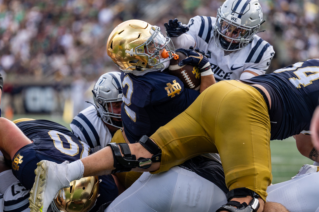 Notre Dame running back Nolan James Jr. (2) scores a touchdown during the first half of an NCAA college football game against Rice, Saturday, Sept. 12, 2026, in South Bend, Ind. (AP Photo/Paul Barnick)