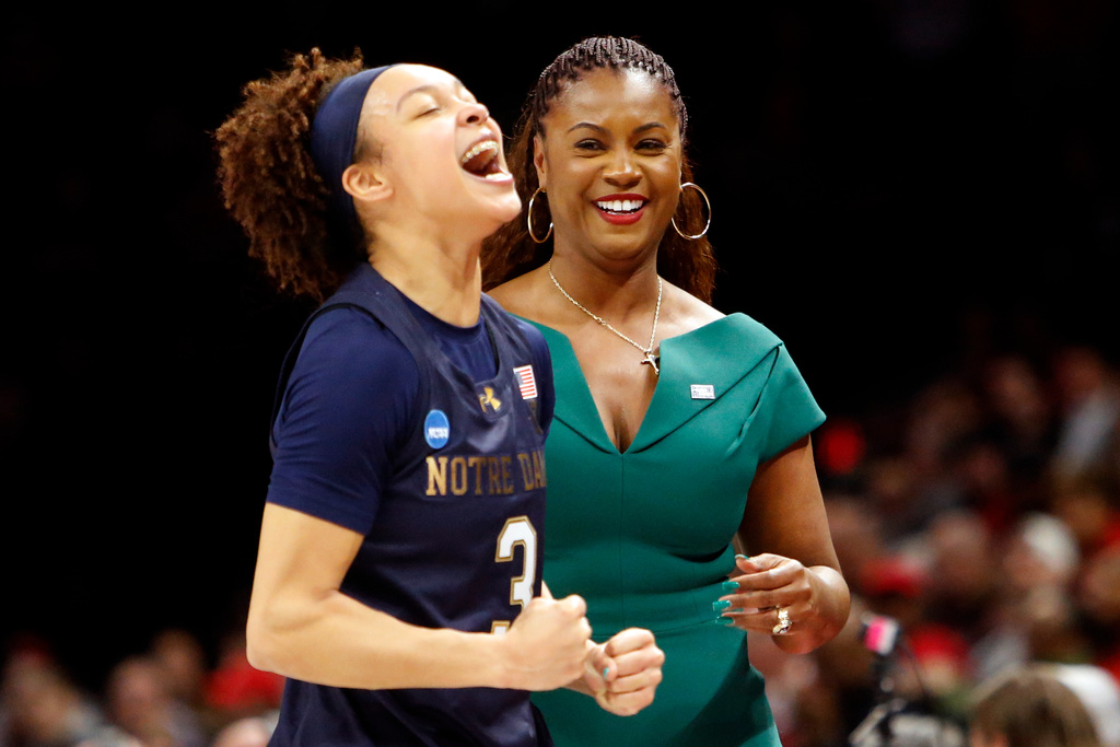 Notre Dame guard Hannah Hidalgo (3) celebrates with head coach Niele Ivey after defeating Ohio State in the second round of the NCAA college basketball tournament, Monday, March 23, 2026, in Columbus, Ohio. (AP Photo/Tom E. Puskar)
